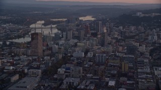 5.5K aerial stock footage flying by Downtown Portland cityscape by the Willamette River at twilight, Oregon Aerial Stock Footage | AX155_219