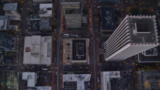 5.5K aerial stock footage of a bird's eye view of buildings between SW 6th Avenue SW 5th Avenue at twilight, reveal Pioneer Courthouse, Downtown Portland, Oregon Aerial Stock Footage | AX155_229E