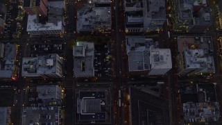 5.5K aerial stock footage of a bird's eye view follow SW 5th Avenue at twilight and reveal Pioneer Place and Courthouse, Downtown Portland, Oregon Aerial Stock Footage | AX155_240E