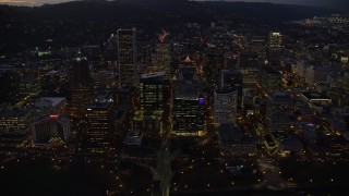 5.5K aerial stock footage crossing Hawthorne Bridge to approach Downtown Portland's skyscrapers at twilight, Oregon Aerial Stock Footage | AX155_270E