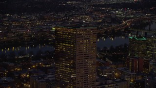 5.5K aerial stock footage orbiting the top of US Bancorp Tower at night in Downtown Portland, Oregon Aerial Stock Footage | AX155_275