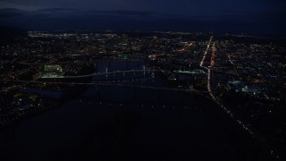 5.5K aerial stock footage following I-5 freeway, Downtown Portland cityscape, bridges on the Willamette River at night, Oregon Aerial Stock Footage | AX155_290E