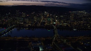 5.5K aerial stock footage of skyscrapers in downtown and Willamette River bridges at night, Downtown Portland, Oregon Aerial Stock Footage | AX155_294E