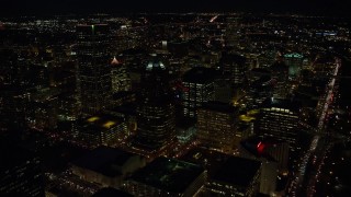 5.5K aerial stock footage flying over KOIN Center and Wells Fargo Center, and reveal city squares at night in Downtown Portland, Oregon Aerial Stock Footage | AX155_328E