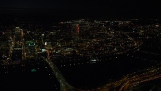 5.5K aerial stock footage flying by the Downtown Portland cityscape, and bridges over the Willamette River at nighttime Aerial Stock Footage | AX155_359E