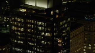 5.5K aerial stock footage of the top floors of Park Avenue West Tower at night in Downtown Portland, Oregon Aerial Stock Footage | AX155_385