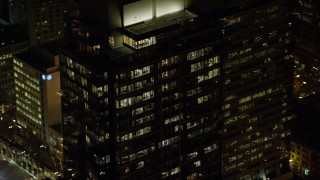 5.5K aerial stock footage orbiting the top floors of Park Avenue West Tower at night in Downtown Portland, Oregon Aerial Stock Footage | AX155_386