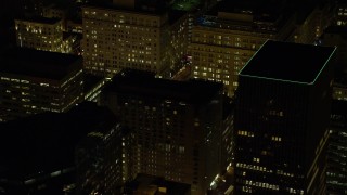 5.5K aerial stock footage flying by high-rises to reveal SW 5th Avenue at night in Downtown Portland, Oregon Aerial Stock Footage | AX155_390