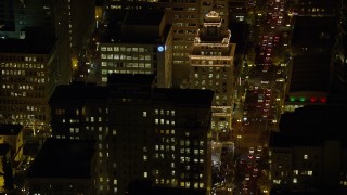 5.5K aerial stock footage flying by Jackson Tower and SW Broadway at night in Downtown Portland, Oregon Aerial Stock Footage | AX155_394E