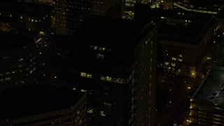 5.5K aerial stock footage orbiting the dark upper floors of an office building at night in Downtown Portland, Oregon Aerial Stock Footage | AX155_396E