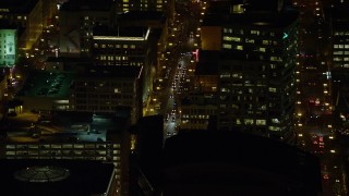 5.5K aerial stock footage of city traffic on SW 3rd Avenue at nighttime in Downtown Portland, Oregon Aerial Stock Footage | AX155_398