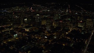 5.5K aerial stock footage passing downtown high-rises and skyscrapers at nighttime in Downtown Portland, Oregon Aerial Stock Footage | AX155_400E