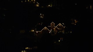 5.5K aerial stock footage approaching a suburban home at night decorated for Christmas, Southwest Portland, Oregon Aerial Stock Footage | AX155_442