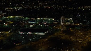 5.5K aerial stock footage flying by a busy strip mall at night in Hillsboro, Oregon Aerial Stock Footage | AX155_472