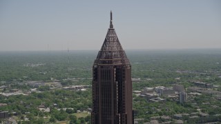 AX36_020E - 4.8K aerial stock footage orbiting the top of Bank of America Plaza, Midtown Atlanta, Georgia