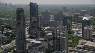 4.8K aerial stock footage flying by skyscrapers, tilt to Marsh Mercer Building rooftop, Buckhead, Georgia Aerial Stock Footage | AX36_073E