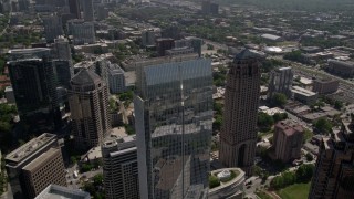 4.8K aerial stock footage approach and tilt to bird's eye view of 1180 Peachtree skyscraper, Midtown Atlanta, Georgia Aerial Stock Footage | AX37_024E