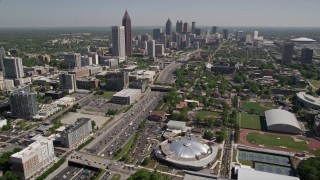 AX37_034E - 4.8K aerial stock footage flying by Georgia Institute of Technology, Midtown and Downtown skyscrapers, Atlanta, Georgia