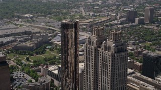 AX37_054E - 4.8K aerial stock footage orbiting 191 Peachtree Tower, revealing Westin Peachtree Plaza, Downtown Atlanta