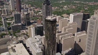 AX37_057E - 4.8K aerial stock footage orbiting Westin Peachtree Plaza Hotel, Downtown Atlanta, Georgia