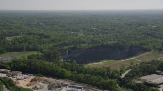 4.8K aerial stock footage approaching a quarry bordering a wooded area, Atlanta, Georgia Aerial Stock Footage | AX37_086