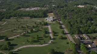 4.8K aerial stock footage flying by a rural elementary school nestled among trees, Atlanta, Georgia Aerial Stock Footage | AX38_002