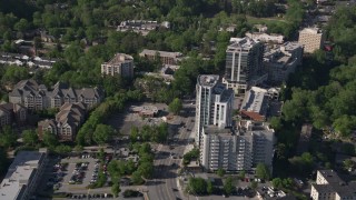 4.8K aerial stock footage following a city road past office and apartment buildings, Buckhead, Georgia Aerial Stock Footage | AX38_008