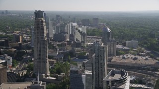 4.8K aerial stock footage tilting down from skyscrapers to Marsh Mercer building, Buckhead, Georgia Aerial Stock Footage | AX38_018