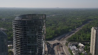 AX38_019 - 4.8K aerial stock footage approaching and orbiting 3344 Peachtree skyscraper, Buckhead, Georgia