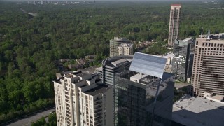 4.8K aerial stock footage tilting down to bird's eye of Marsh Mercer building, Buckhead, Georgia Aerial Stock Footage | AX38_023