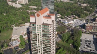 4.8K aerial stock footage of a medium shot of Park Avenue Condos revealing skyscrapers, Buckhead, Georgia Aerial Stock Footage | AX38_024