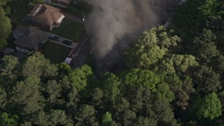 4.8K aerial stock footage of smoke rising from a burning home, West Atlanta, Georgia Aerial Stock Footage | AX38_043E