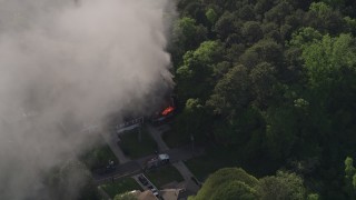 4.8K aerial stock footage of smoke rising from a burning house, West Atlanta, Georgia Aerial Stock Footage | AX38_045E