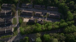 4.8K aerial stock footage of a bird's eye orbiting abandoned buildings among trees, Atlanta Aerial Stock Footage | AX38_081