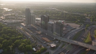 4.8K aerial stock footage flying away from office buildings and The Atlantic apartments, Midtown Atlanta Aerial Stock Footage | AX39_024