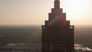 4.8K aerial stock footage orbiting top of SunTrust Plaza, Downtown Atlanta, sunset Aerial Stock Footage | AX39_038