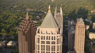 AX39_059E - 4.8K aerial stock footage orbit of the top of One Atlantic Center, Midtown Atlanta, Georgia