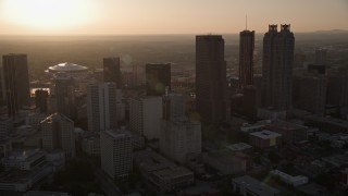 AX39_066 - 4.8K aerial stock footage panning across Downtown Atlanta skyscrapers, Georgia, sunset