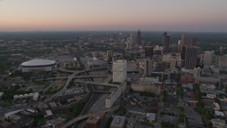 4.8K aerial stock footage of Midtown and Georgia Dome seen while approaching Downtown, Atlanta, Georgia, twilight Aerial Stock Footage | AX40_002E