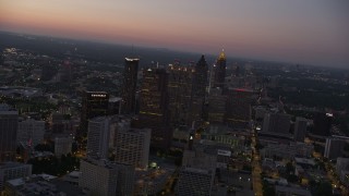 4.8K aerial stock footage flying by skyscrapers Downtown Atlanta toward Midtown, Georgia, sunset Aerial Stock Footage | AX40_016E