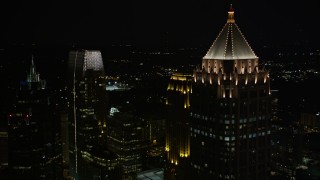 AX41_028E - 4.8K aerial stock footage flyby and orbit skyscrapers around One Atlantic Center, Midtown Atlanta, Georgia, night