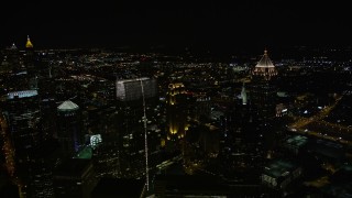 4.8K aerial stock footage flying by skyscrapers towering over the city, Midtown Atlanta, Georgia, night Aerial Stock Footage | AX41_031