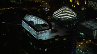 AX41_032 - 4.8K aerial stock footage of a close-up orbiting top of 1075 Peachtree, Midtown Atlanta, Georgia, night