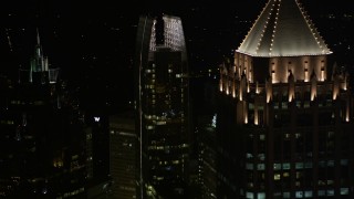 4.8K aerial stock footage orbit 1180 Peachtree revealing GLG Grand and other nearby skyscrapers, Midtown Atlanta, night Aerial Stock Footage | AX41_033E