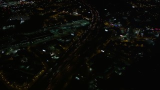 4.8K aerial stock footage tilting to heavy traffic on the expressway, Buckhead, Georgia, night Aerial Stock Footage | AX41_036E