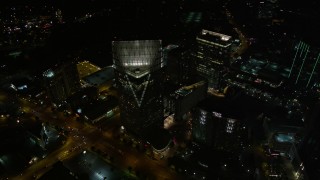 AX41_050E - 4.8K aerial stock footage flying by skyscrapers toward Terminus Atlanta, Buckhead, Georgia