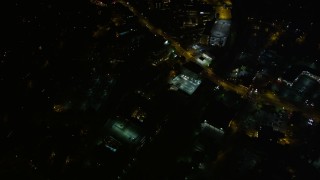 4.8K aerial stock footage following a road through the city, Buckhead, Georgia, night Aerial Stock Footage | AX41_053