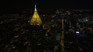 4.8K aerial stock footage flying by Bank of American Plaza toward Downtown, Midtown Atlanta, night Aerial Stock Footage | AX41_057E