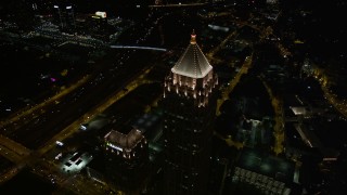 AX41_070E - 4.8K aerial stock footage approaching One Atlantic Center, tilt to bird's eye view, Midtown Atlanta, Georgia, night