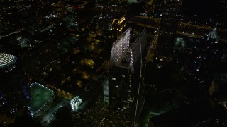 4.8K aerial stock footage approach and tilt to bird's eye of 1180 Peachtree and GLG Grand, Midtown Atlanta, night Aerial Stock Footage | AX41_072E